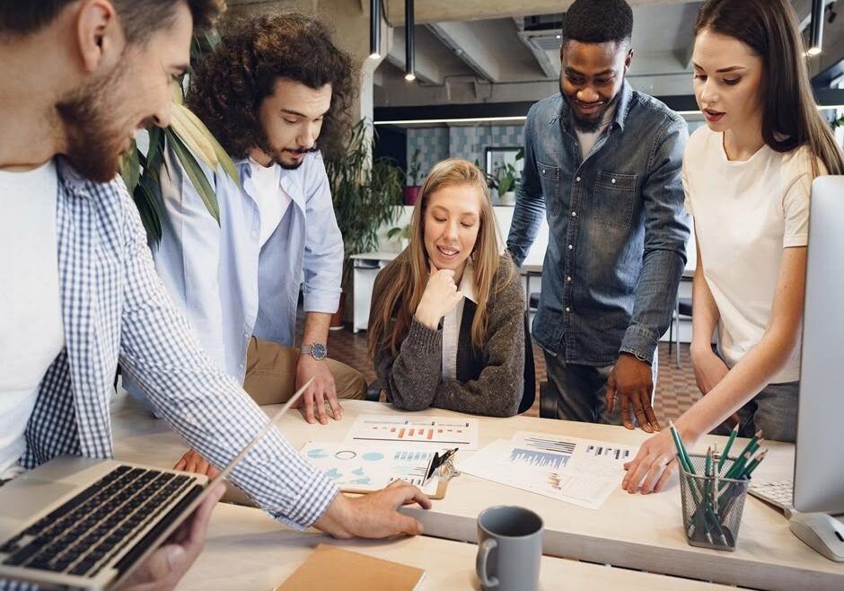 team-diverse-coworkers-modern-office-discuss-their-project-together resize
